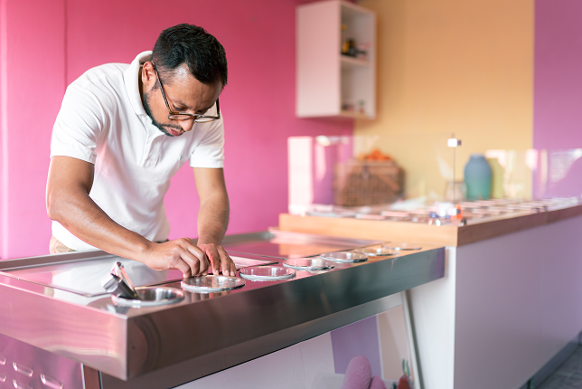 an-ice-cream-parlor-worker-is-preparing-all-the-to-2023-11-27-04-52-31-utc 1