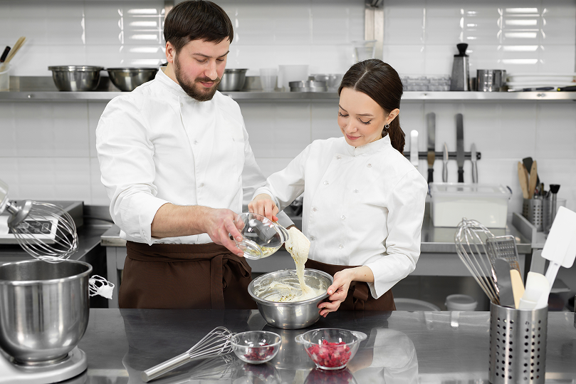 front-view-pastry-chef-preparing-cake-with-chocolate 13