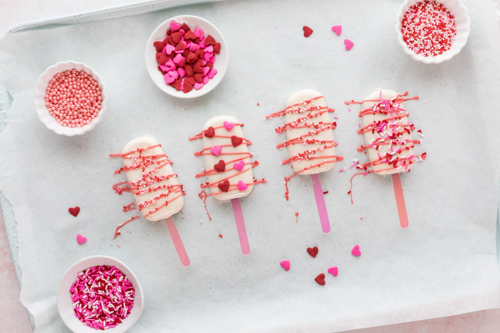 homemade-cakesicles-drizzled-with-candy-melts-decorated-with-sprinkles